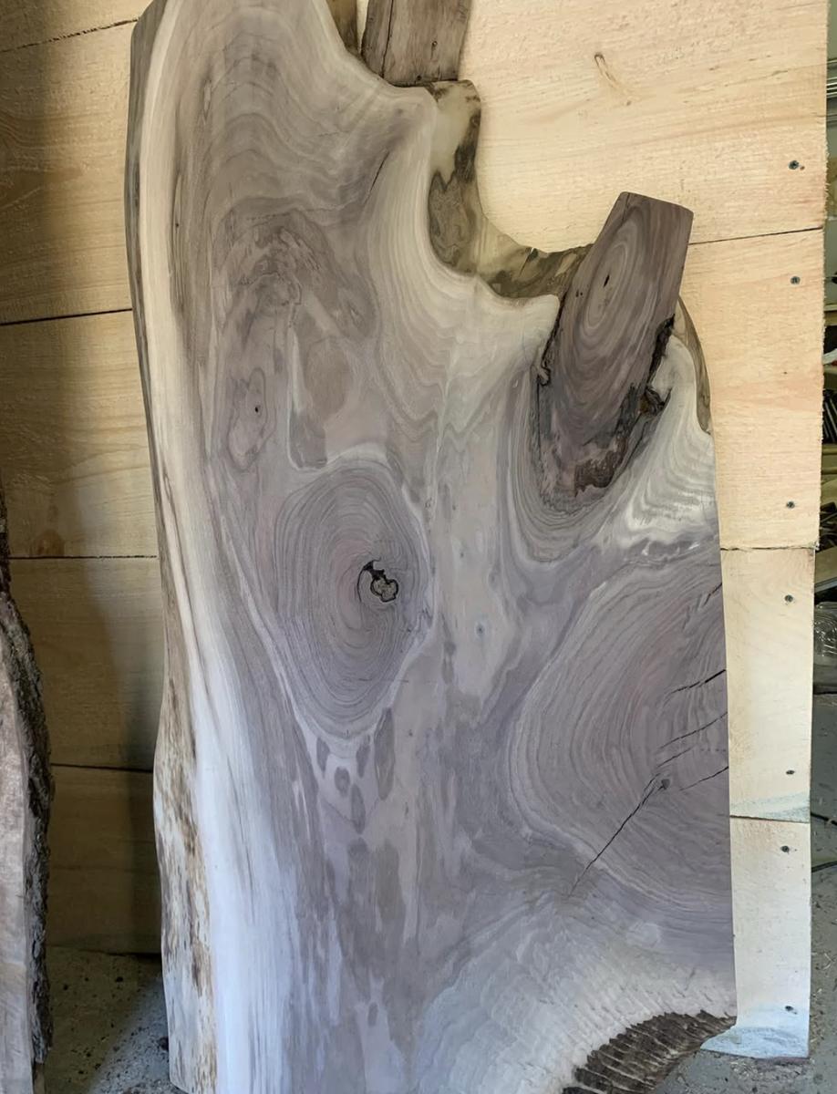 Dark live edge slab with natural edge